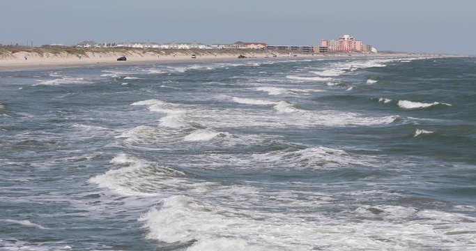 Corpus Christi Texas sandy beach coast from ocean. Beautiful southern Texas, Gulf of Mexico Ocean beach. Padre Island, Mustang Island, Corpus Christi.  Waves and surf on sand. Summer vacation destinat