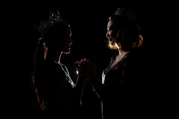 Two Silhouette Shadow Back Rim Light of Miss Pageant Beauty Queen Contest with Silver Diamond Crown...