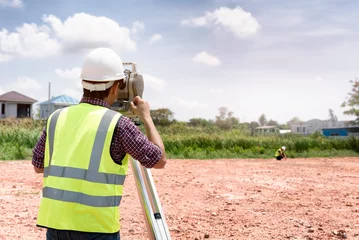 Foto op Canvas Surveyor equipment. Surveyor’s telescope at construction site or Surveying for making contour plans are a graphical representation of the lay of the land before startup construction work © kokliang1981