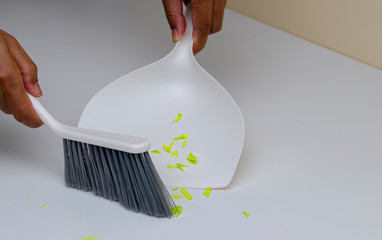 Cleaning by dustpan and brush - 249440962