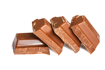 Tasty milk brown chocolate close-up isolated on white background