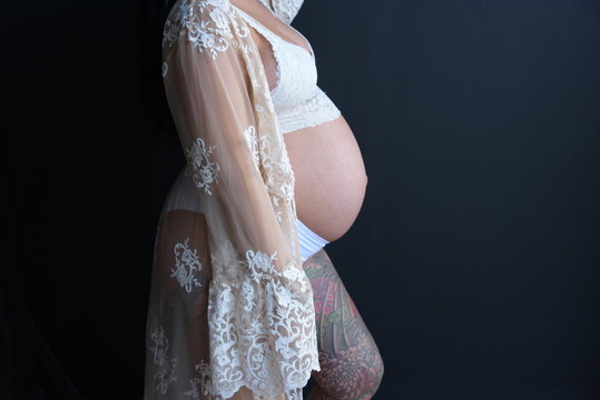 Pregnan mother in white
