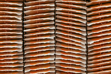 Top view, tea bags neatly arranged to rows in box.