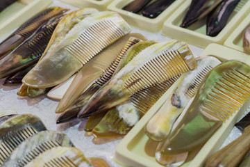 horn combs for sale in flea market.