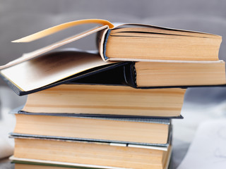 Stack of old vintage books on wooden shelf in  university library