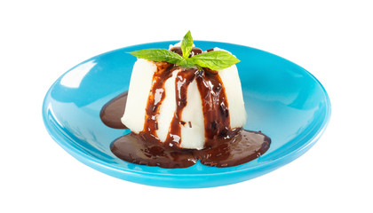 Cream pudding with chocolate sauce and mint