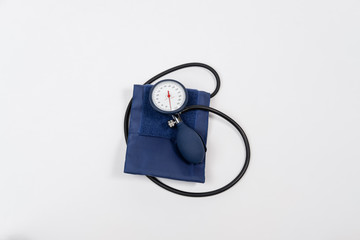 Manual blood pressure sphygmomanometer isolated on white background