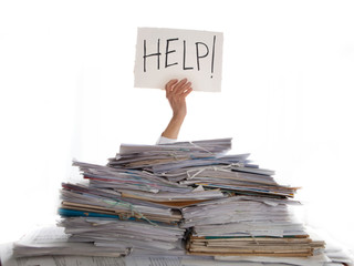 Person under a pile of papers with a hand holding a sign of help. Accounting.