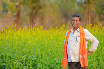 Indian farmer at black musterd field