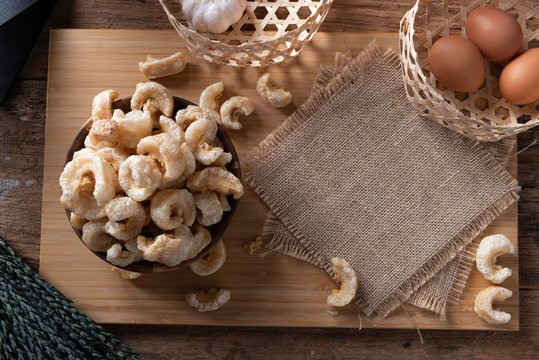 Pork rinds also known as chicharon or chicharrones , kab moo