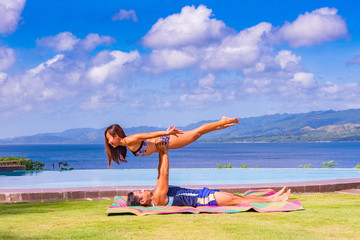 Filipino couple at the beach and yoga poses