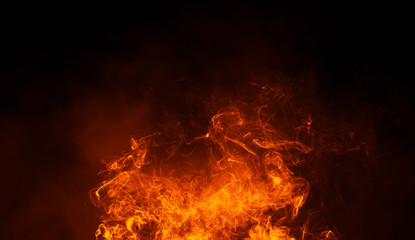 Texture of burn fire with particles embers. Flames on isolated black background. Texture for banner,flyer,card © Victor