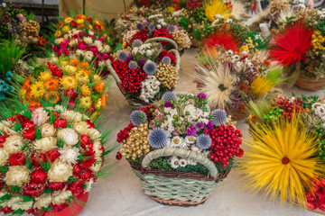 Baskets with colorful flowery decorations for sale