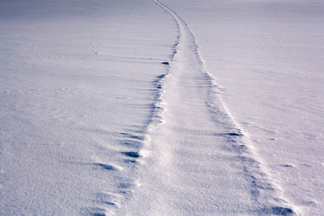 Scenic view of snow covered field against sky on sunny day. Ural