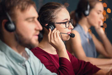 Female technical support agent working in office