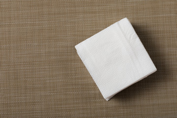 Paper napkin on textured background.