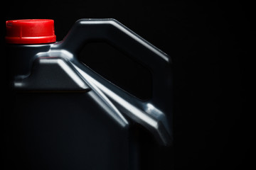 bottle of machine oil on black