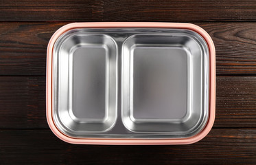 Empty school lunch box on wooden background