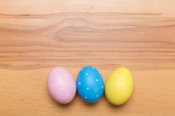 Easter eggs on wooden background