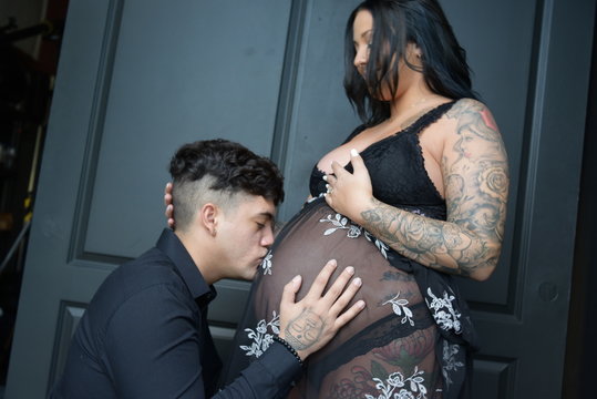 Couples in black pregnant wife