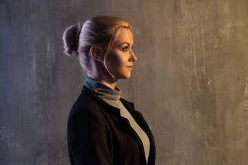 Fototapeta premium Portrait of beautiful blonde woman. Calm and self-confidence. Beautiful adult girl in black turtleneck