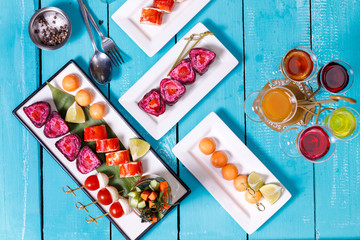 Catering. Away the food. snacks on blue wooden background. the view from the top