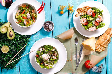 salad on a wooden blue table.