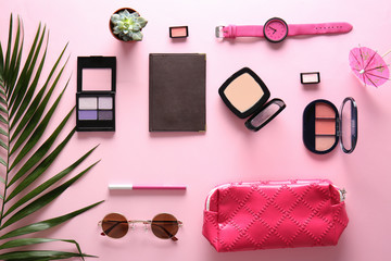 Flat lay composition with cosmetics, accessories and passport on color background