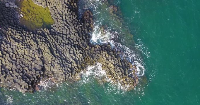 Vietnam natural landscape. Stock footage Ganh Da Dia reef in Phu Yen, Vietnam with special stones, rock make great terrain. Aerial view, top view of Ganh Da Dia sea with amazing basalt causeway shape