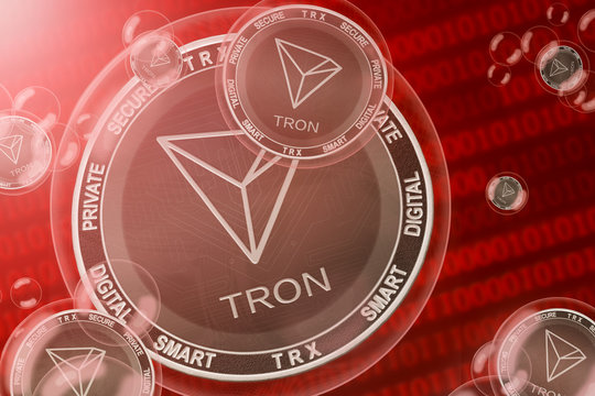 Tron currency crash; TRON (TRX) coins in a bubbles on the binary code background. Close-up.