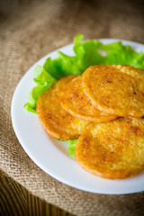 potato pancakes with lettuce leaves in a plate