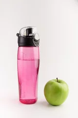 Foto op Aluminium green apple and sports bottle water isolated on white background © Konstantin Maslak