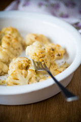 baked cauliflower with spices in ceramic form