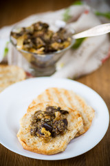 appetizer of cooked eggplant with vegetables on bread
