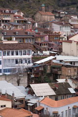 Streets and houses in Tbilisi the day. Old town.  georgia 2019. people, cars, hills, old beautiful buildings located on the hill and near the river