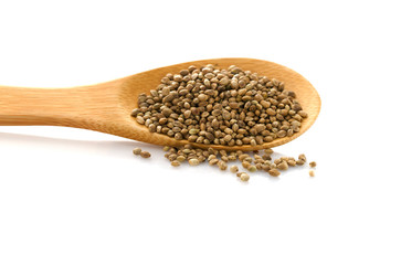 Hemp seed. Wooden spoon with hemp. Food additive. Isolated on white background. Cannabis.