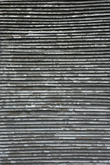 Old metal grill with peeling paint. Abstract background