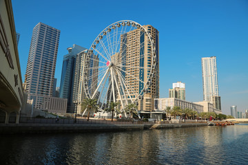 Fototapeta na wymiar Ferris wheel near Al Qasba canal in Sharjah city, United Arab Emirates