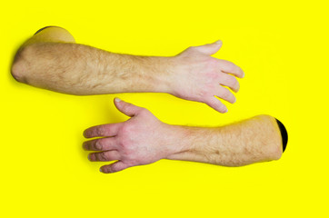 Embrace or hugging design template.Male hands hugging somebody against yellow background.Concept of support