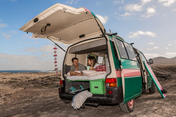 Couple in trunk of caravan