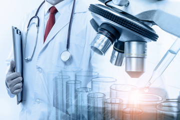 Doctor with microscope, medical research and development concept