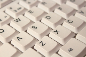 White computer keyboard. Close-up. Background. Texture.