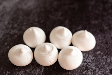 white meringue on a dark background