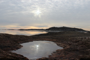 Naklejka na ściany i meble sunset in swedish archipelago with rock pool