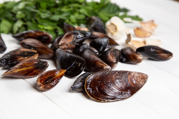 Cook ingredients - fresh raw mussels with parsley and garlic