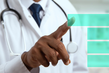 Doctor hand pressing button on screen.