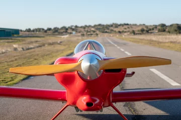 Foto op Canvas small red propeller plane © charlymorlock