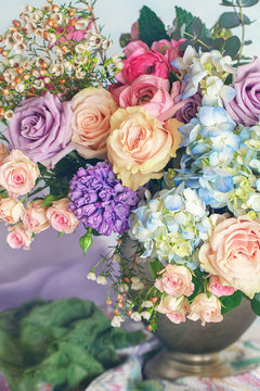 Beautiful bouquet of spring flowers in a vase on the table. Lovely bunch of flowers .