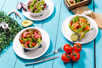 salad on a wooden blue table.