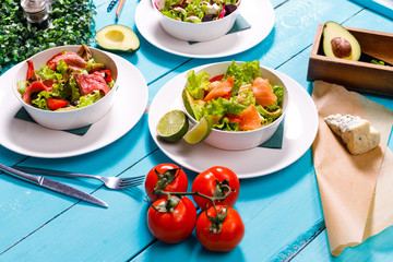 salad on a wooden blue table.